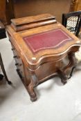 A Victorian walnut and mahogany Davenport desk