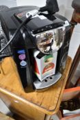 A Bosch Tassimo coffee pod machine and a part box of pods