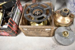 A vintage Primus stove, sold with small fig crate and two oil lamps
