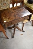 A reproduction Regency style occasional table having drop flaps on turned column and quadruple legs,