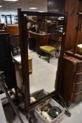 A 19th Century Regency mahogany cheval mirror, height approx. 161cm, missing finials