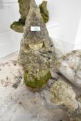 A concrete garden figure, modelled as monk