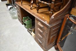 An early Century oak roll top desk, width approx. 182cm