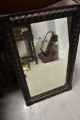 A 19th Century wall mirror having bobbin turned style decoration to frame, approx. 82 x 51cm