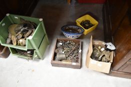 A selection of antique and later furniture fittings such as handles, escutcheons etc