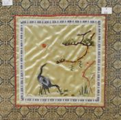 Two Chinese embroidered silk-work panels, depicting cranes within landscape settings, within