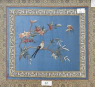 Two Chinese embroidered silk-work panels, depicting birds perched amongst foliage and within