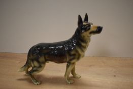 A Goebel German Shepherd, stands at 23cm tall.