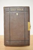 Holy Bible. A late Nineteenth century example, leather bound with brass clasp to fore-edge. (1)