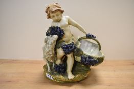 A Capodimonte style figure depicting a young boy with basket having blue berry decoration,