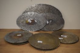 A selection of vintage silver plated placemats including ten round, two medium and one large oval