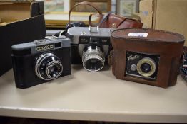 Three cameras. A Saraber Finetta Super, a Halina Paulette and a Cosmic 35 all A/F and a Leningrad