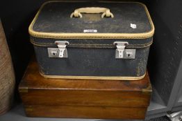 A vintage writing desk AF and a vintage overnight case.