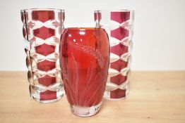 A vintage etched ruby vase with signature to base and a pair of ruby red Luminarc crystal vases.