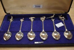 A boxed collection of six teaspoons by Exquisite EJ Ltd with animal themed terminals including a