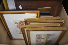 A carton of assorted pictures and prints.