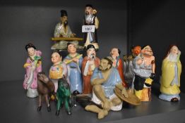 A group of 20th century Chinese porcelain figures, various to include two mud men figures one with