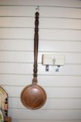 A vintage copper bed warmer sold along with a lockable cash box.