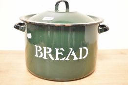 A vintage green enamel bread bin.