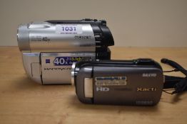 A Sony Hybrid Handycam and a Sanyo Xacti camera