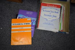 A box of music scores, several types include The Beatles Clarinet, Pianoforte 1982, The Easiest June