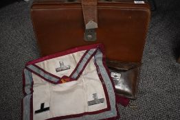 A vintage leather attaché case containing a leather wallet embossed with Bro: John Taylor, Fenwick