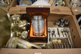 A collection of boxed flatware including teaspoons and servers, tea set on tray, egg cups and a