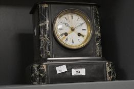 A small late 19th / early 20th century French slate and marble eight day mantel clock, having a