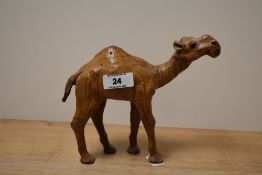 A mid 20th century Liberty's of London type camel sculpture, having lovely aged leather on hand