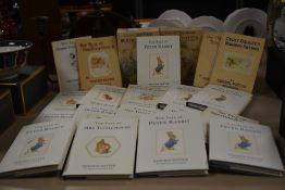 An assortment of Beatrix Potter books including titles 'The Tale of Peter Rabbit', 'The Tale of