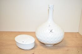 A 20th century Meissen onion shaped vase, having textured dot pattern on a white glaze ground,