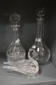 A Luigi Bormioli onion shaped glass decanter, h33cm, sold alongside a cut crystal decanter having