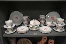 A Royal Albert Bone China Elfin pattern part tea service, comprising of 11 cups, 12 saucers, 9