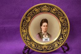 A Royal Vienna hand-painted portrait plate, having a well painted central portrait of a young woman,
