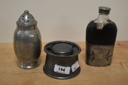 A Pewter sugar caster and captains inkwell, sold together with a silver plated hip flask.