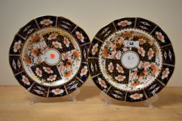 Two 19th Century Royal Crown Derby cabinet plates, of scalloped outline and decorated in a
