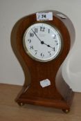 An Edwardian balloon shaped mantel clock by Butt & Co. Ltd. of Chester, the inlaid mahogany case