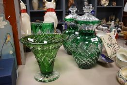 A good quality pair of cut crystal baluster lidded vases, beautifully decorated with clear cut