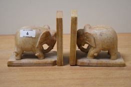 A pair of vintage carved pink elephant book ends, h11.5cm.