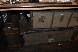 An early 20th Century brown leather attache case, measuring 42cm long, together with three hard
