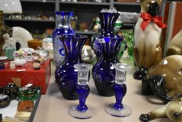 A pair of Bohemian style cobalt blue overlay cut crystal glass vases measuring 21cm sold together