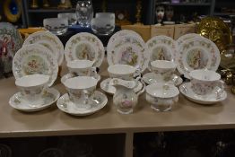 A Beatrix potter Royal Albert Bone China part tea service, decorated depicting various characters,