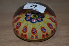 An Millefiori style bowl glass paperweight, having strong vivid yellow, orange and blue colours,