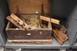A vintage joiners tool box containing a Waring & Gillow Ltd woodworkers journal, various wooden