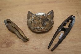 A pair of cast-brass novelty nut-crackers, formed as female legs, sold together with another pair of