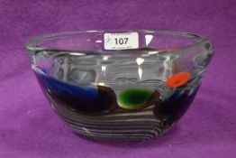 A John Ditchfield clear art glass bowl, the design featuring white swirls and a band of varying