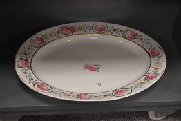 A large 19th century Derby ashette, hand coloured around the edge with pink flowers and gilding,