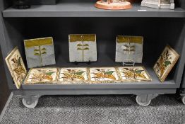 A group of three Minton successinist tiles, impressed Minton marks to base, W15.5cm, sold together