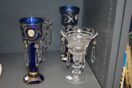A pair of late 19th / early 20th century blue glass lustres having tear drop crystal pendents,