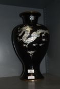 A 20th century Oriental Mother-of-Pearl inlaid baluster vase, all against a black enamel ground,